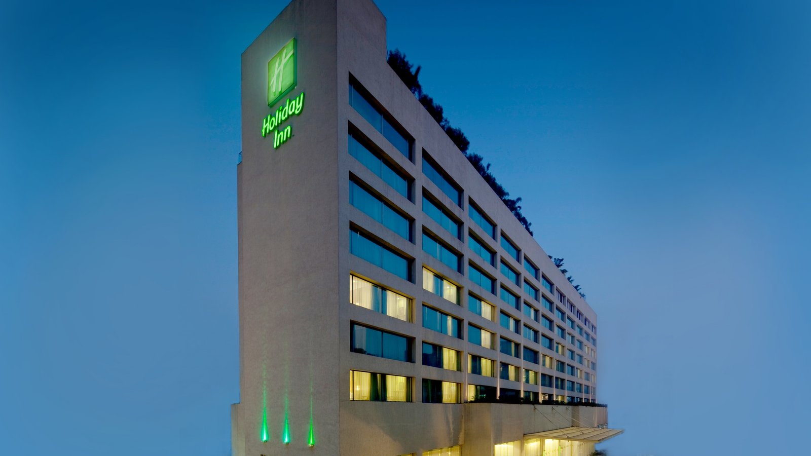 Holiday Inn Mumbai International Airport hotel exterior at dusk