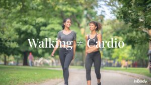 Two women walking with bold text saying 'Walking ≠ Cardio' by InBody